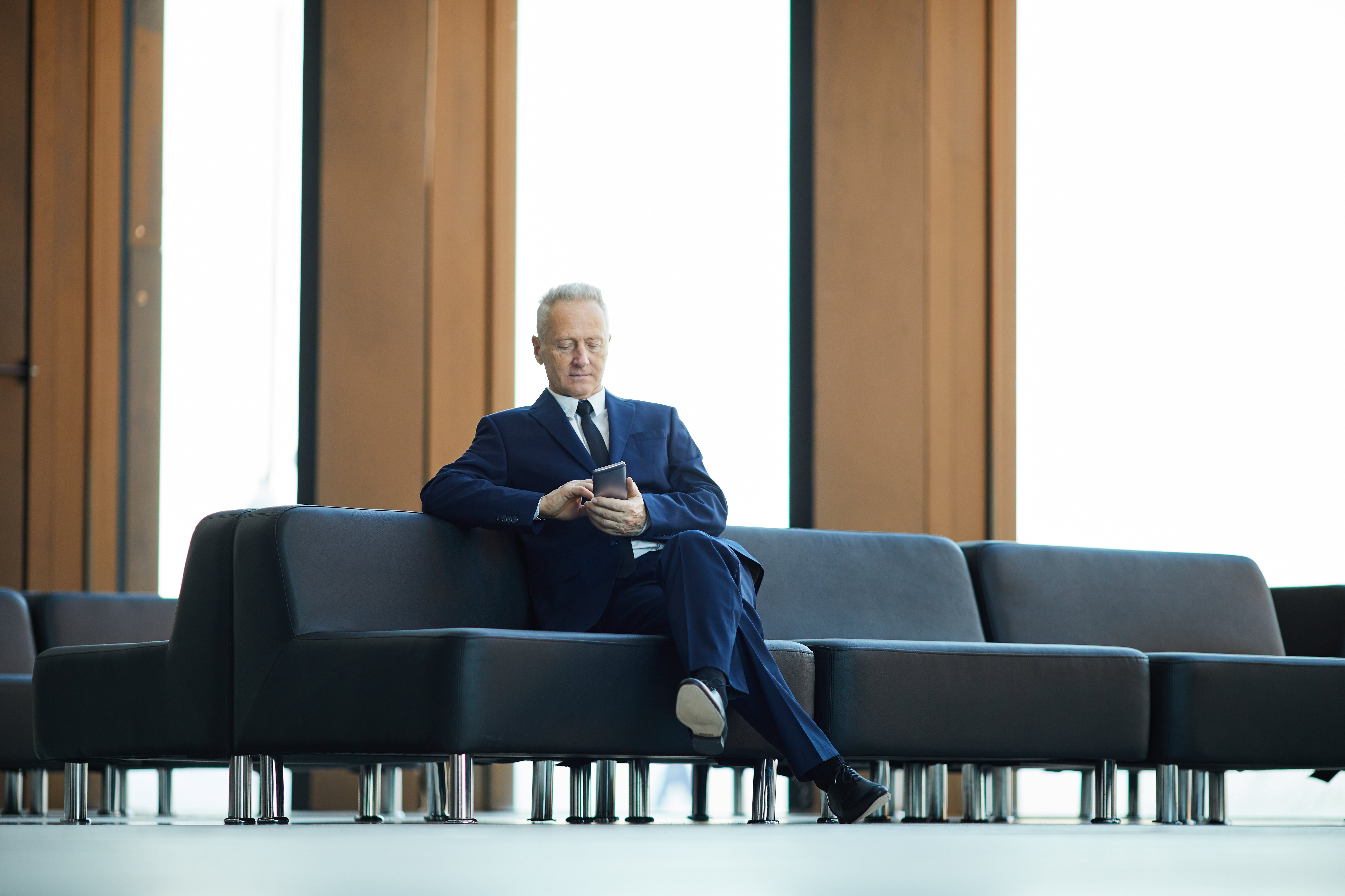 mature-businessman-in-lobby-2023-11-27-05-22-57-utc